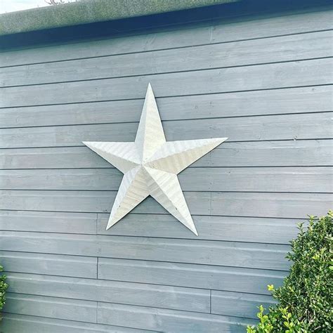 metal stars on house|white stars on house.